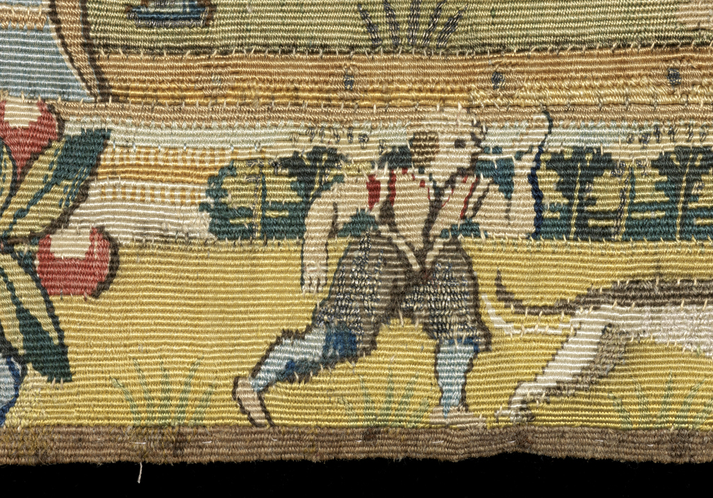 Tapestry detail showing a farming scene